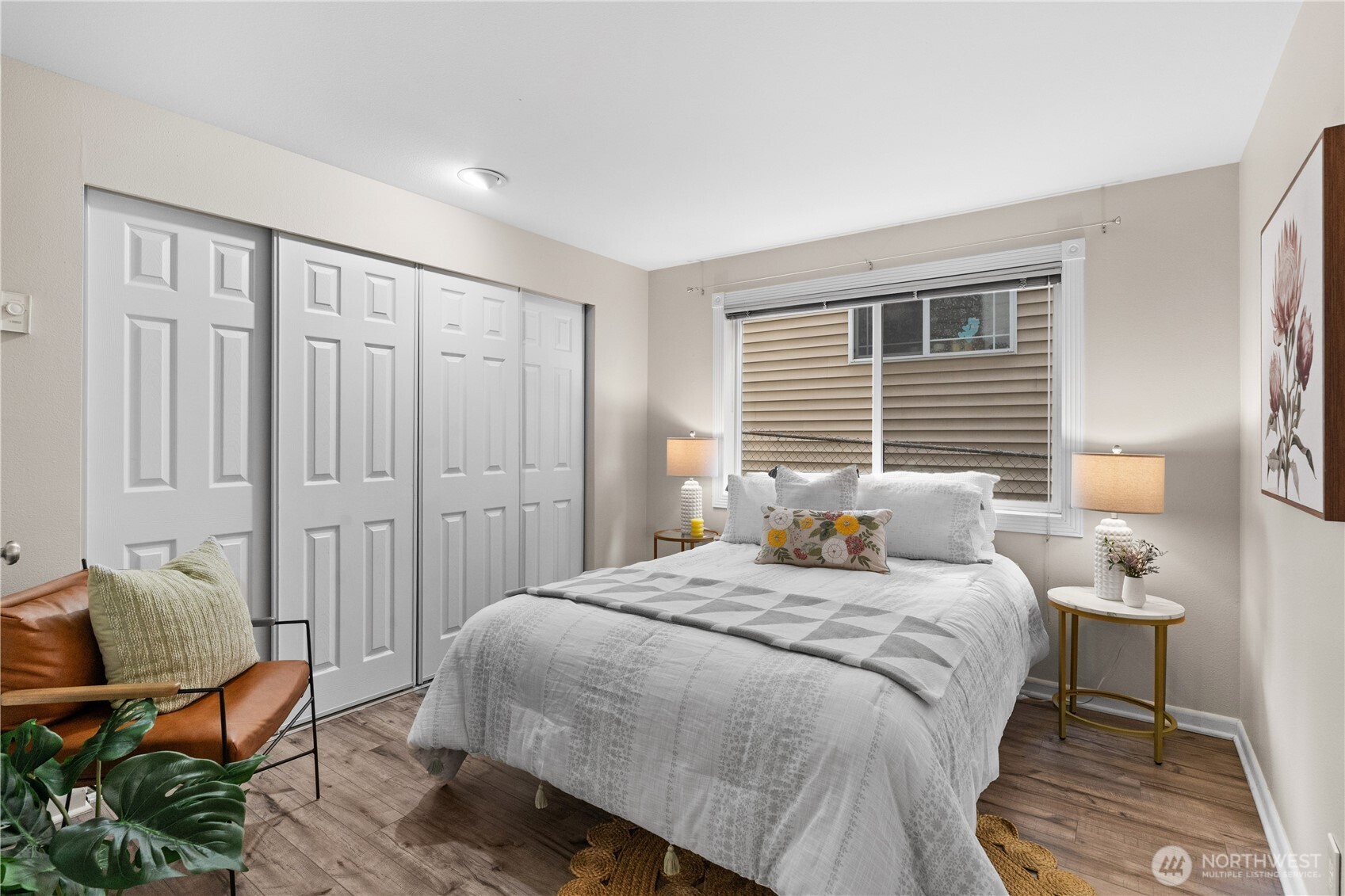 8720 Phinney Avenue North, Unit 11 Seattle, WA 98103 - Photo 19 of 28 a bedroom with a bed and furniture