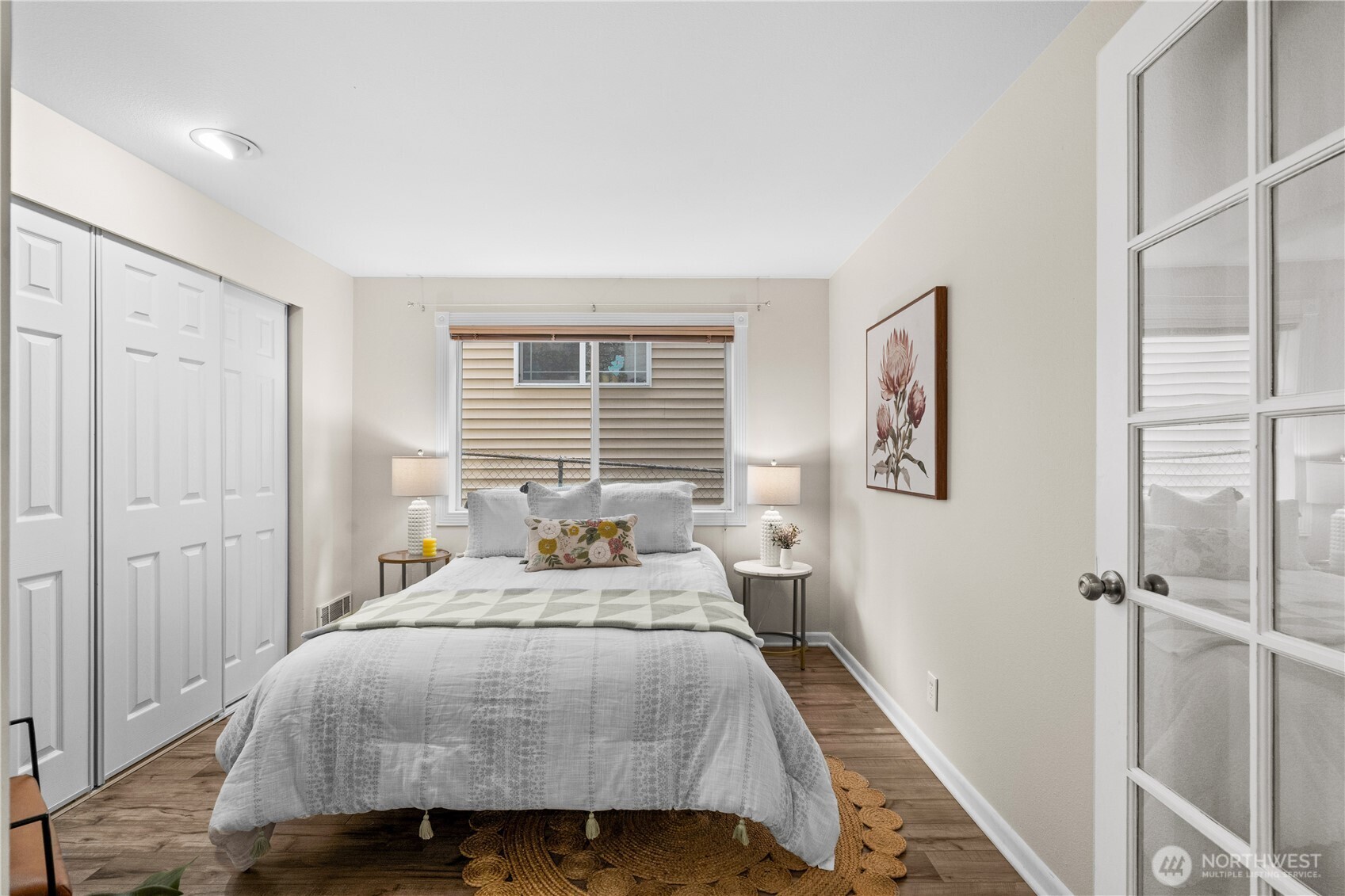 8720 Phinney Avenue North, Unit 11 Seattle, WA 98103 - Photo 20 of 28 a bedroom with a bed and a window