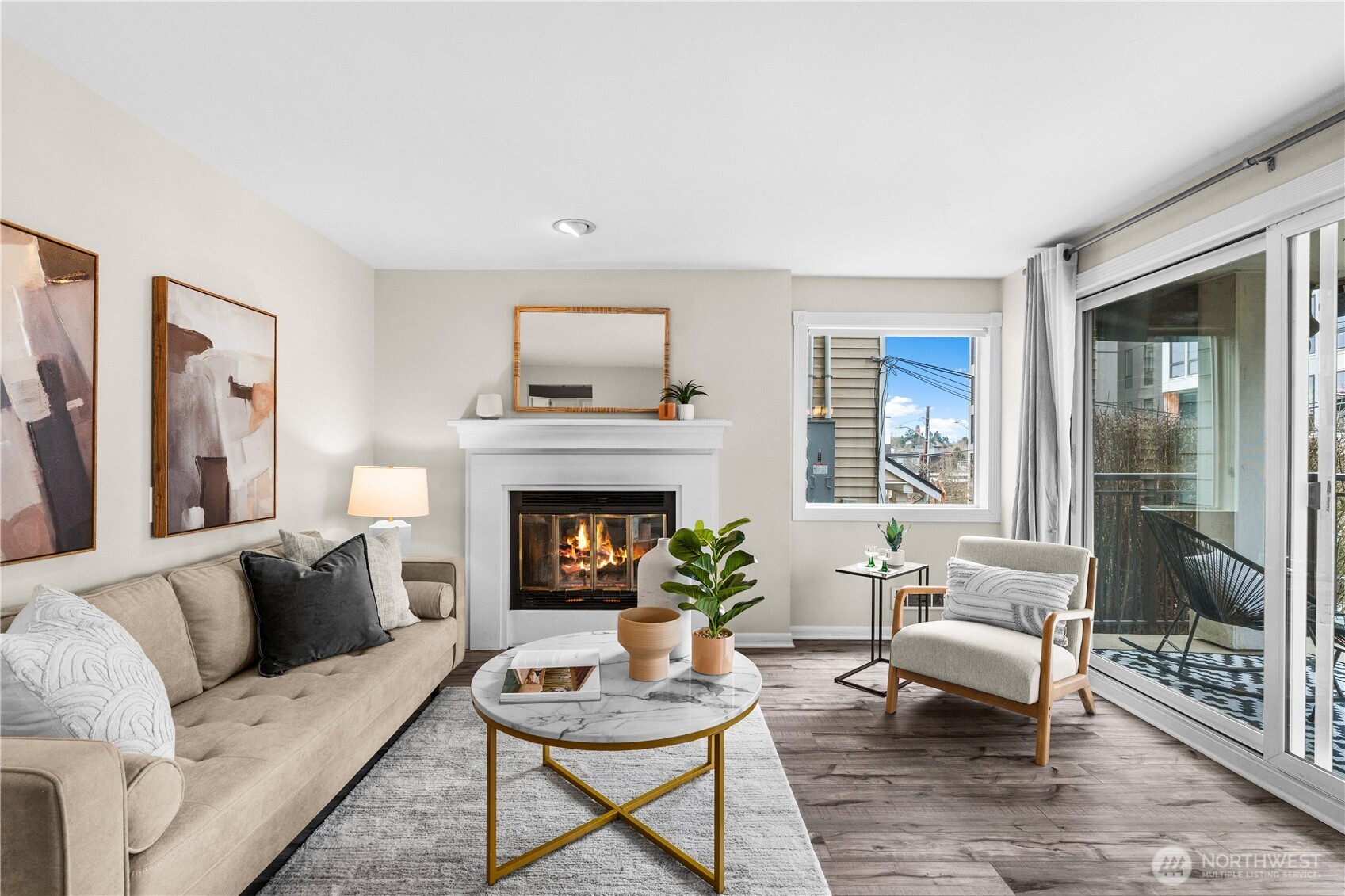 8720 Phinney Avenue North, Unit 11 Seattle, WA 98103 - Photo 2 of 28 a living room with furniture and a fireplace