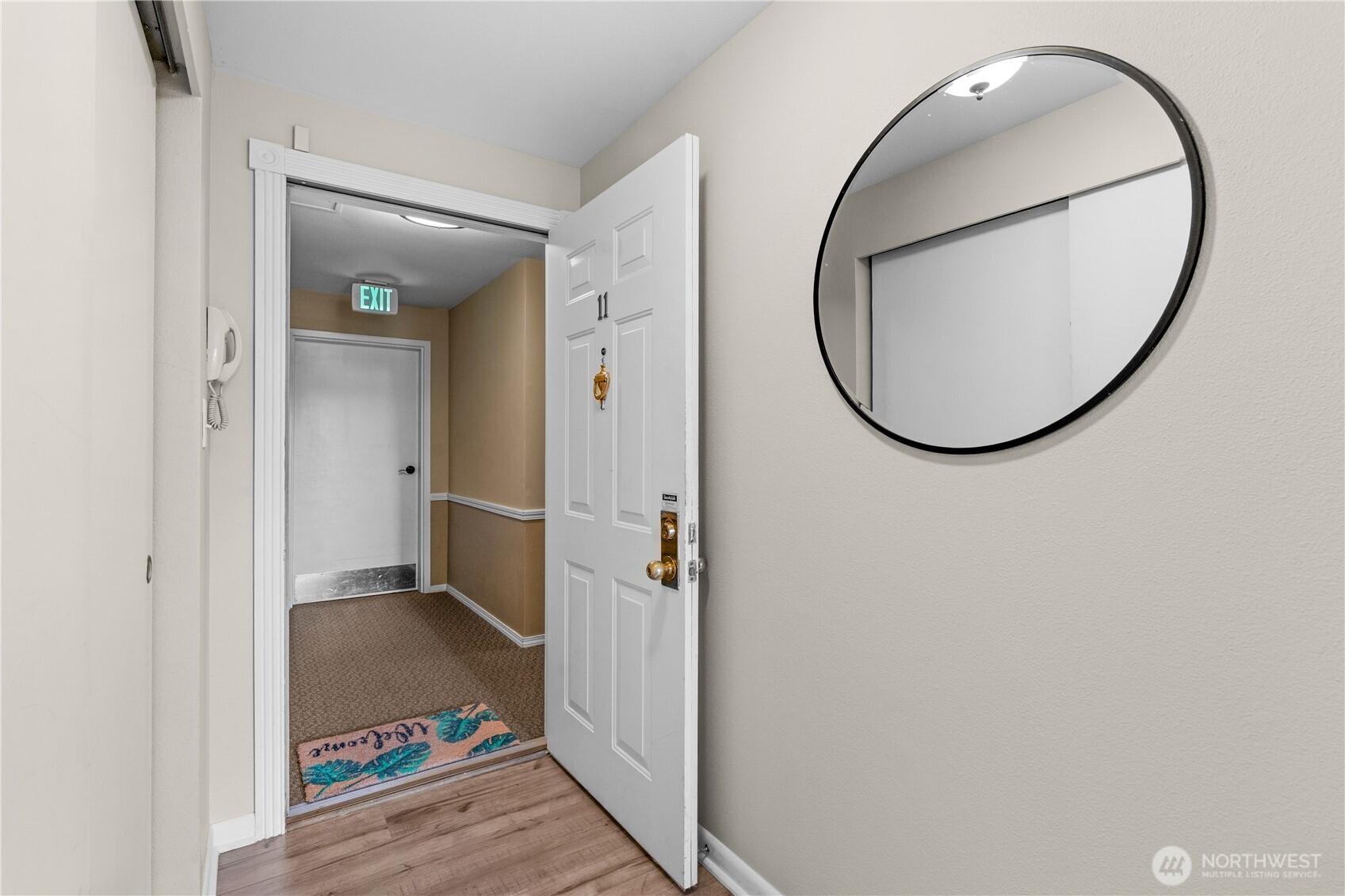8720 Phinney Avenue North, Unit 11 Seattle, WA 98103 - Photo 22 of 28 a view of a livingroom from a hallway