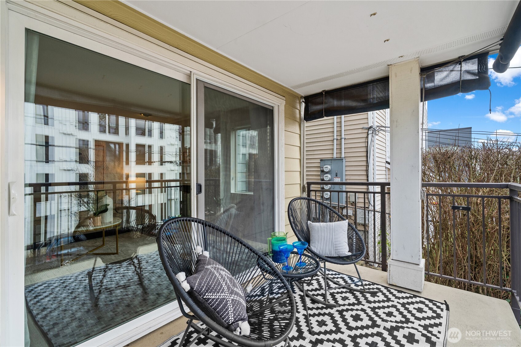 8720 Phinney Avenue North, Unit 11 Seattle, WA 98103 - Photo 23 of 28 a balcony view with a couch and wooden floor