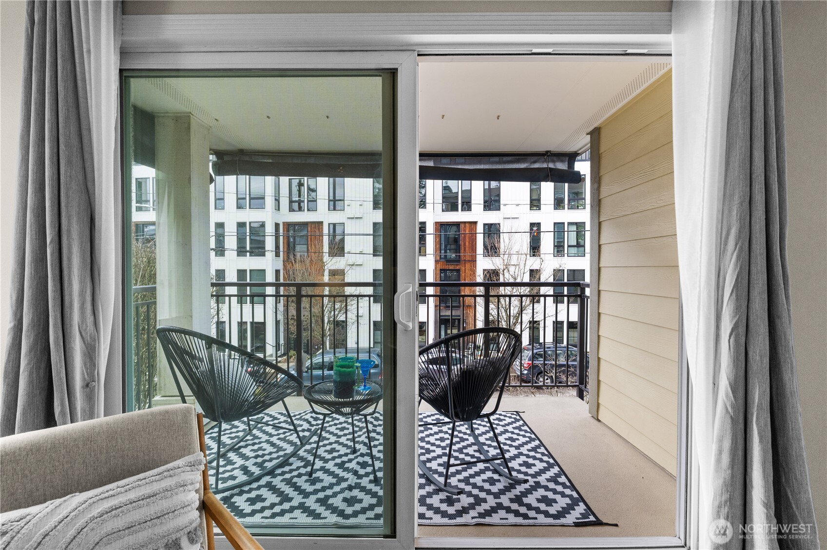 8720 Phinney Avenue North, Unit 11 Seattle, WA 98103 - Photo 24 of 28 a view of a balcony with furniture