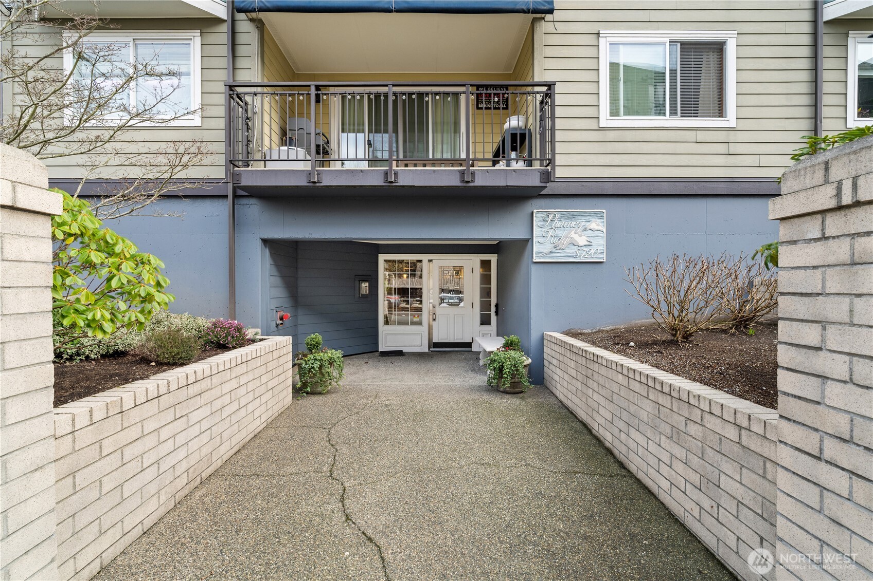 8720 Phinney Avenue North, Unit 11 Seattle, WA 98103 - Photo 27 of 28 a front view of a house with a yard