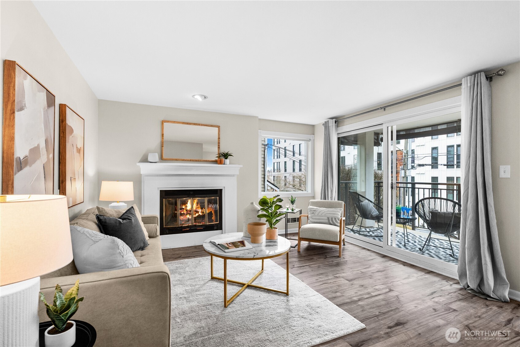 8720 Phinney Avenue North, Unit 11 Seattle, WA 98103 - Photo 4 of 28 a living room with furniture and a fireplace