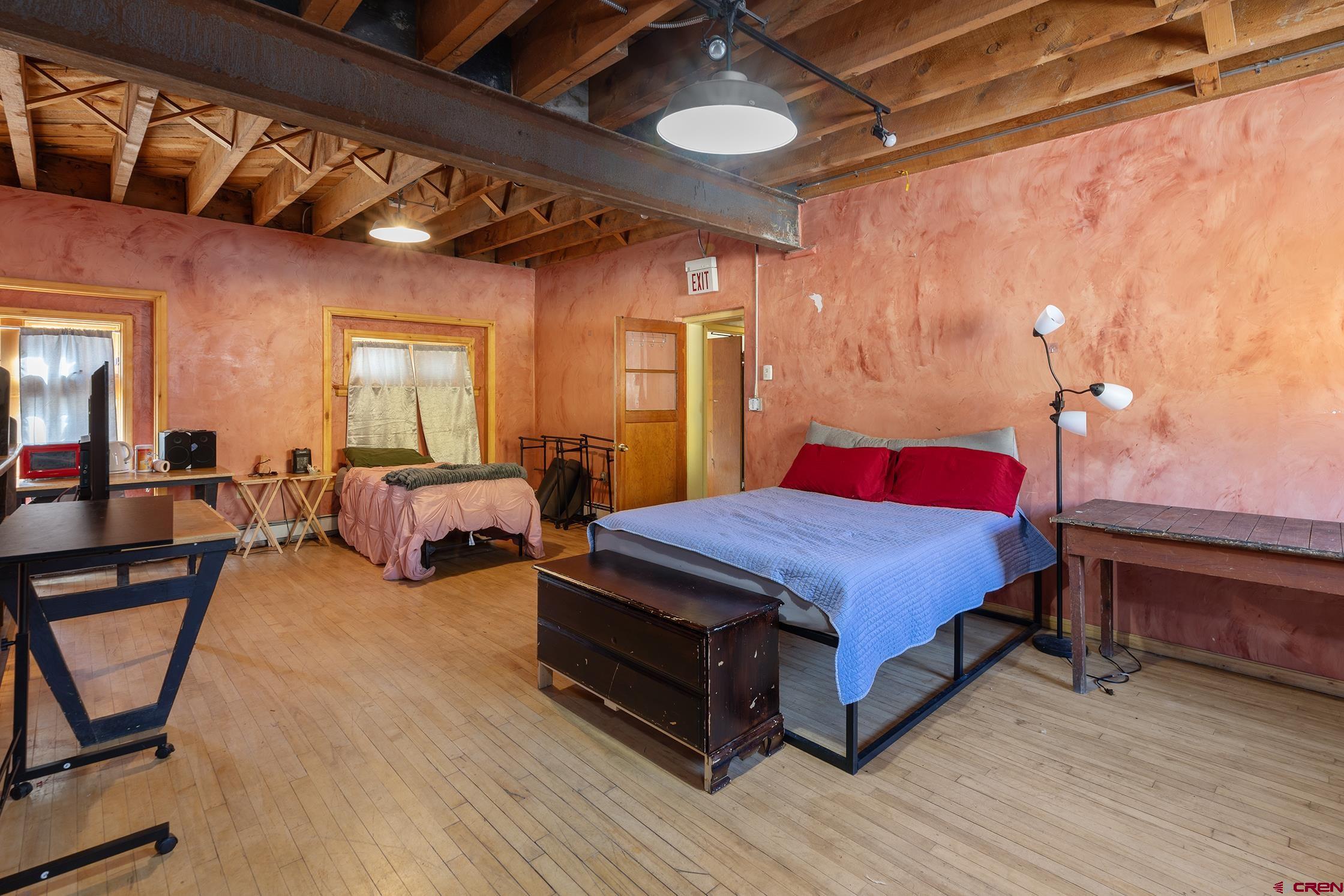 5 South Glasgow Avenue Rico, CO 81332 - Photo 15 of 21 a spacious bedroom with a bed a table and chair