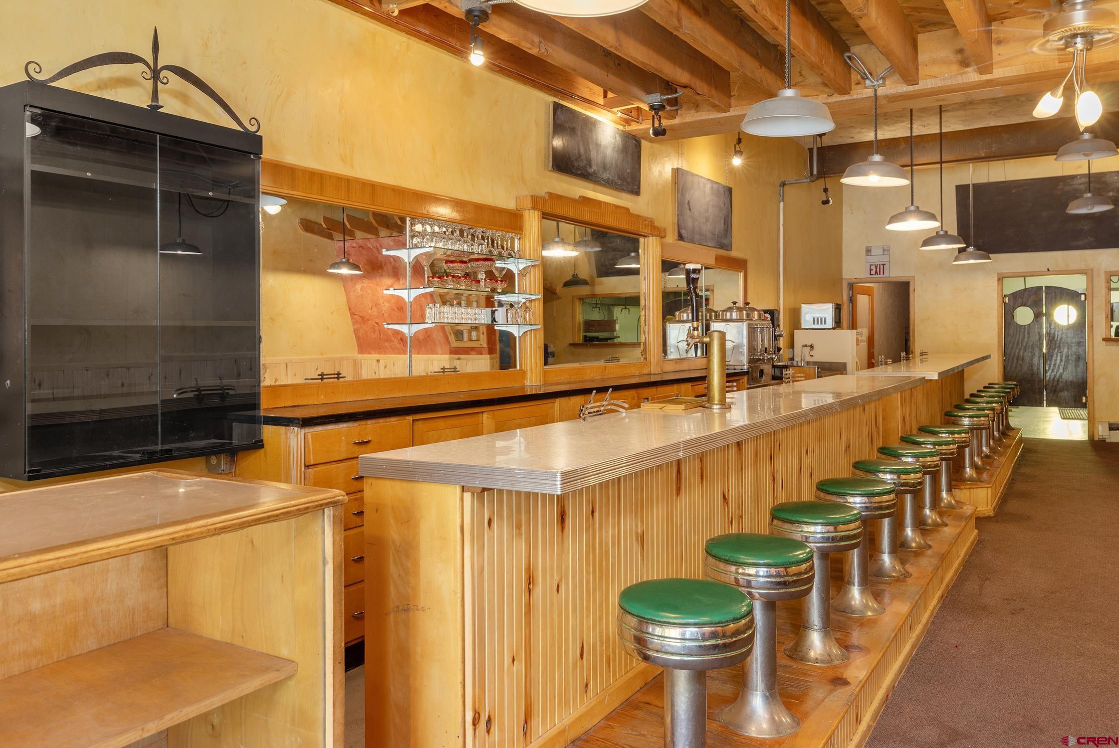 5 South Glasgow Avenue Rico, CO 81332 - Photo 10 of 21 a view of a patio with a table and chairs