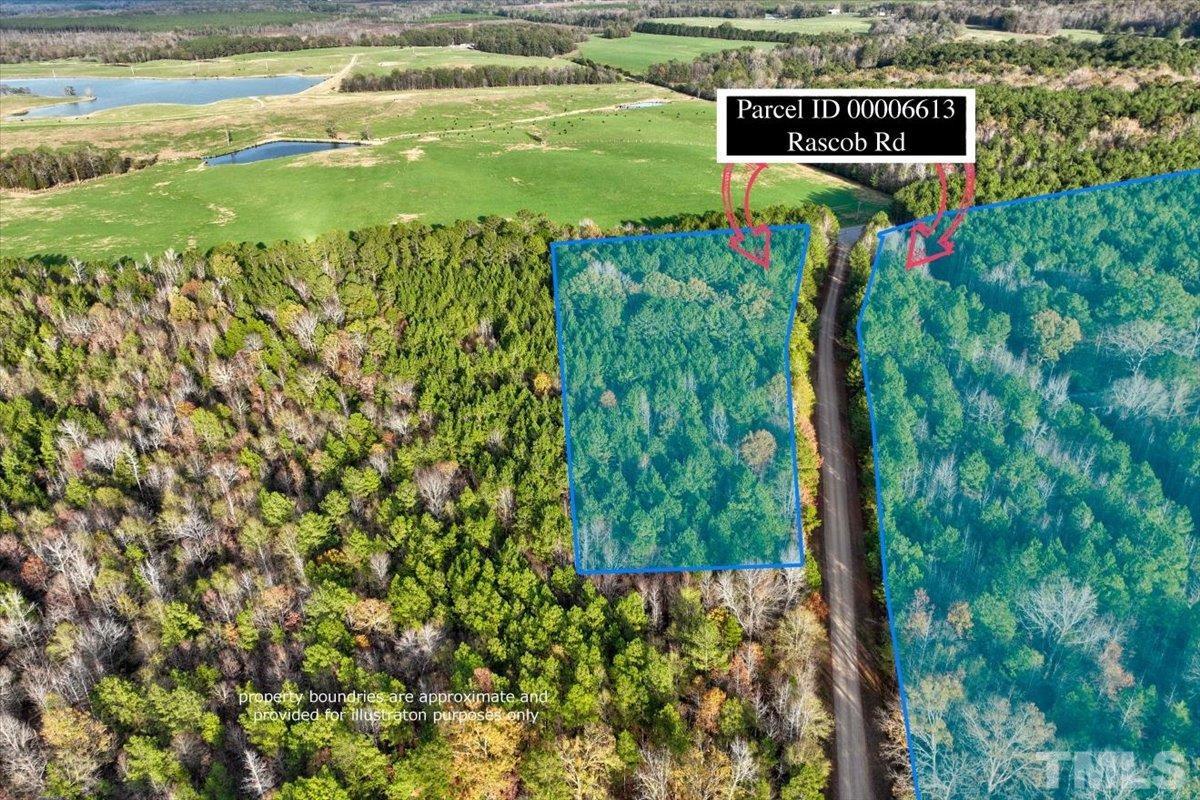 0 Rascob Road Sanford, NC 27330 - Photo 3 of 7 a sign that is sitting in the grass next to a building