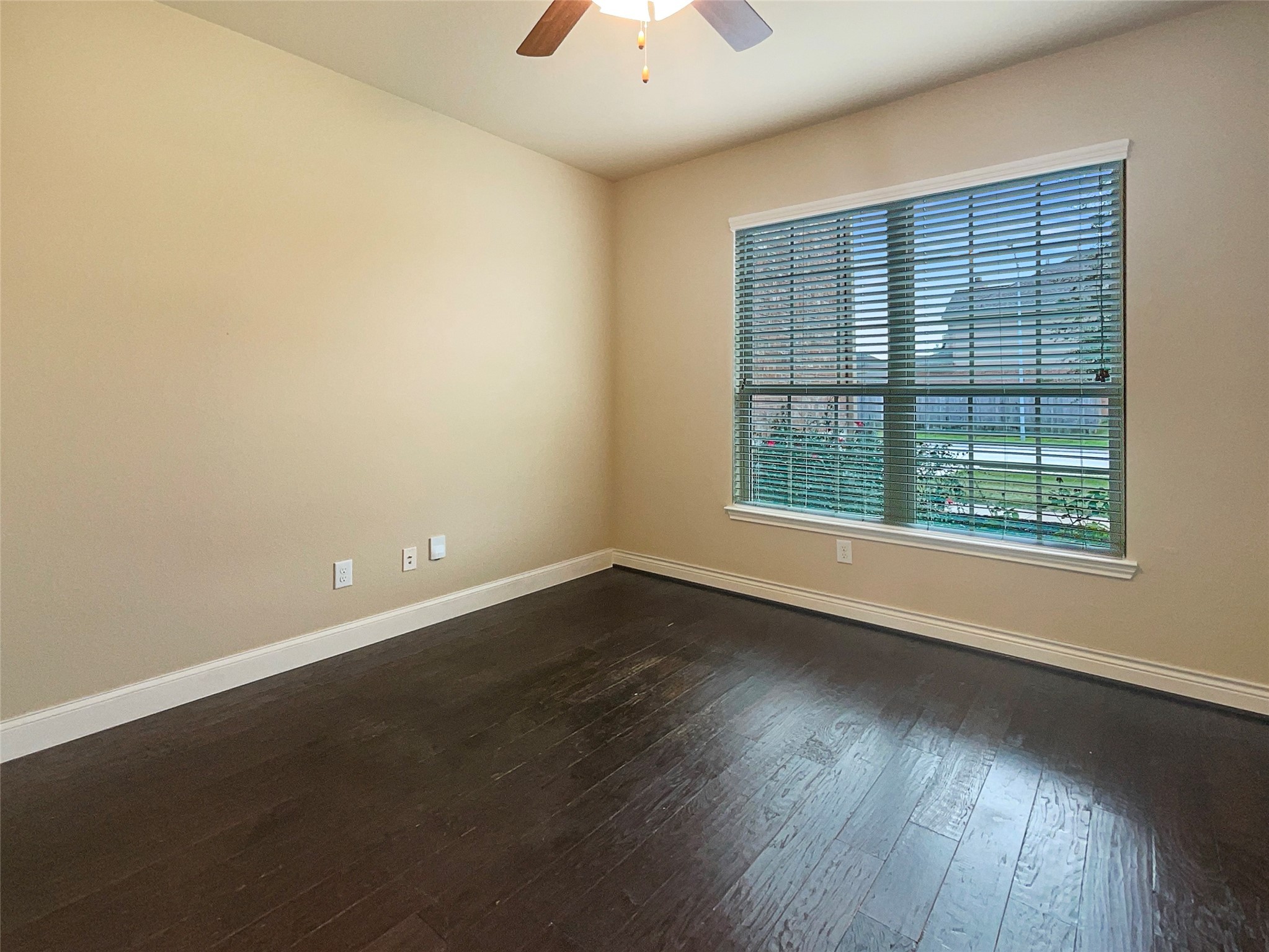 24542 North Denham Ridge Lane Spring, TX 77389 - Photo 7 of 26 an empty room with wooden floor and windows