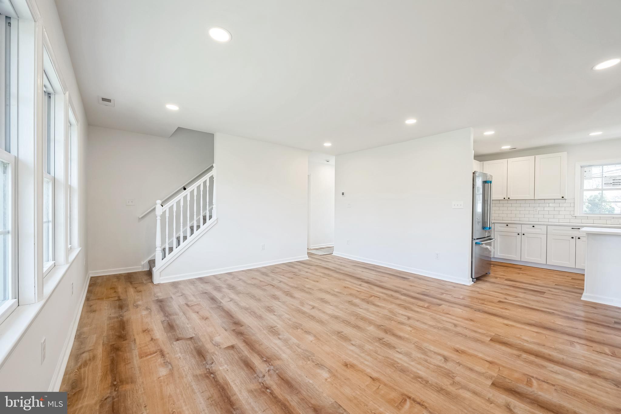 5 River Lane Levittown, PA 19055 - Photo 17 of 35 a view of empty room with wooden floor and windows