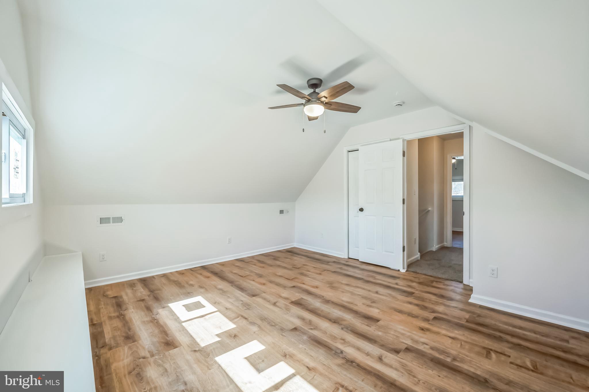5 River Lane Levittown, PA 19055 - Photo 34 of 35 a view of a big room with wooden floor and windows in a room