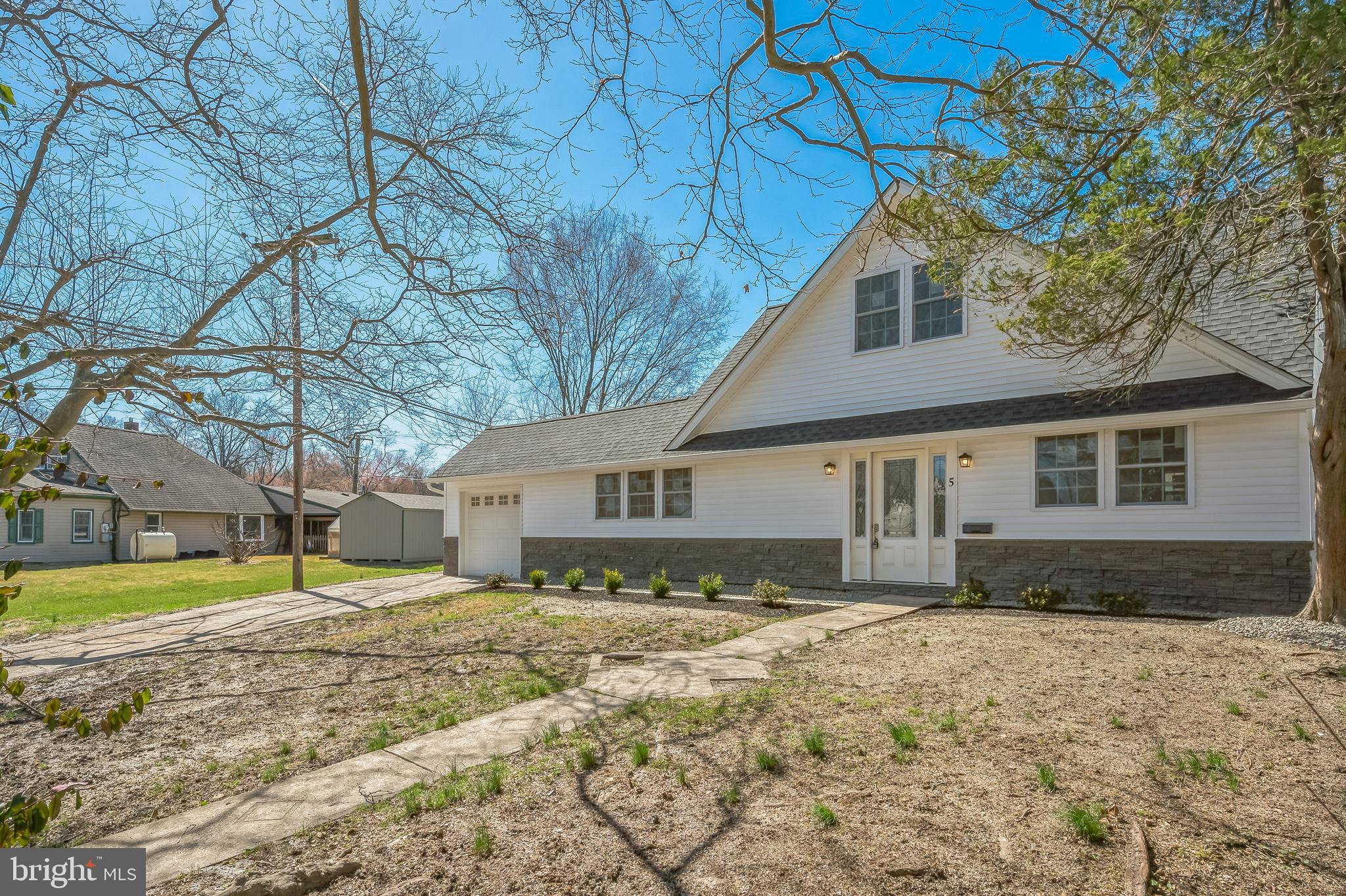 5 River Lane Levittown, PA 19055 - Photo 5 of 35 a view of a house with a yard