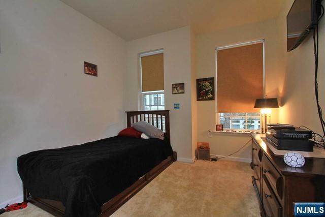 22 Clover Lane Garfield, NJ 07026 - Photo 11 of 17 a bedroom with a bed and a window