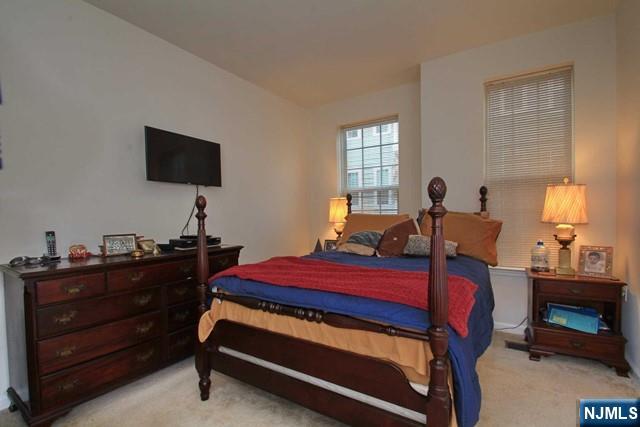 22 Clover Lane Garfield, NJ 07026 - Photo 12 of 17 a bed room with a bed and a television