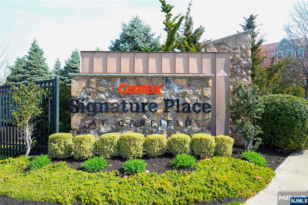 22 Clover Lane Garfield, NJ 07026 - Photo 17 of 17 a view of a back yard from a garden