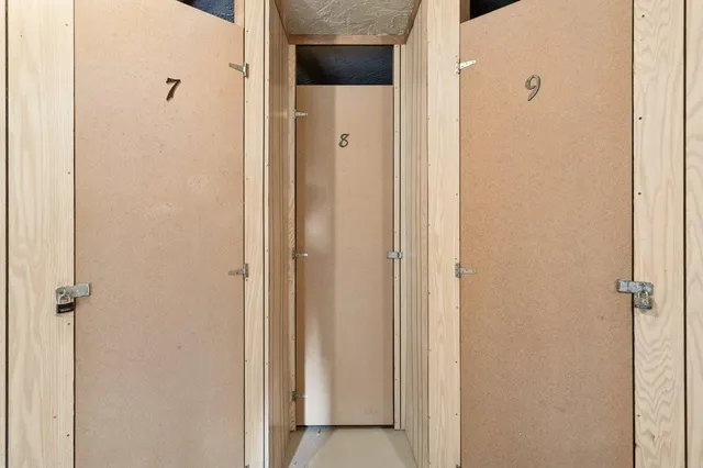 a view of a swimming pool with sitting area and furniture