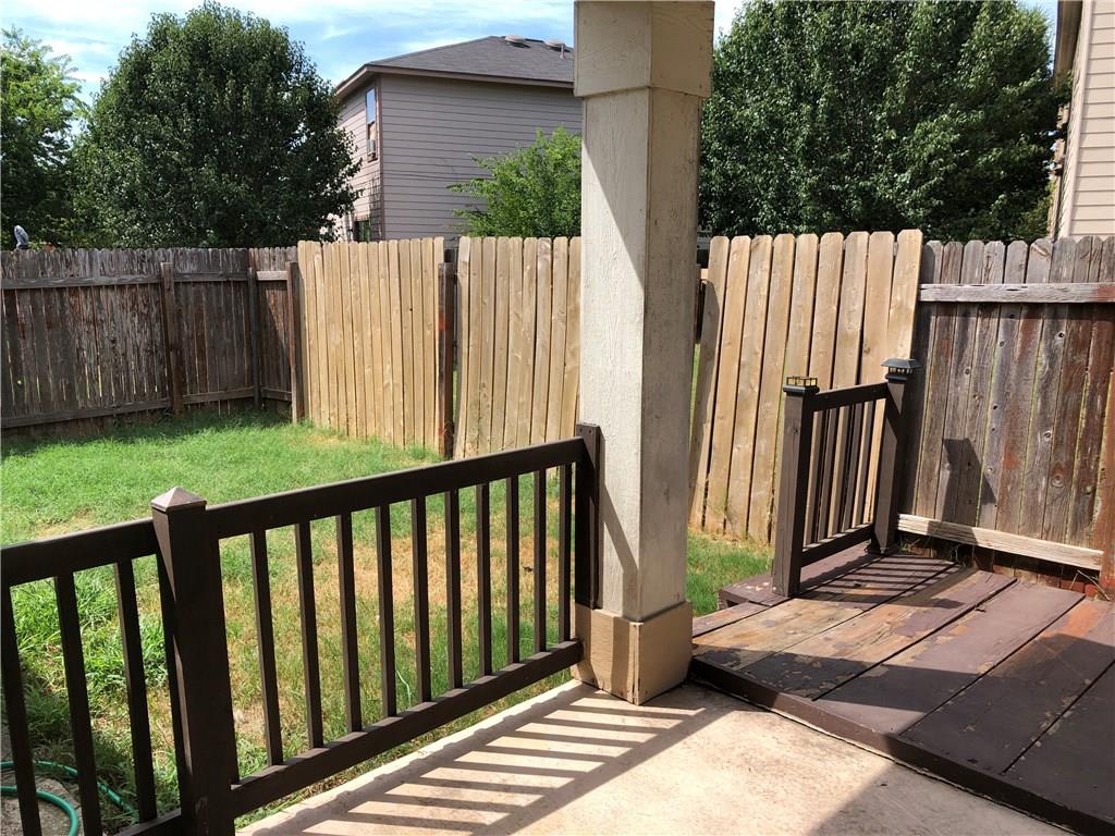 6912 Walkup Lane Austin, TX 78747 - Photo 3 of 14 a view of backyard with wooden fence and large trees