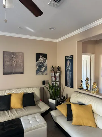 a living room with lots of furniture and gym equipment