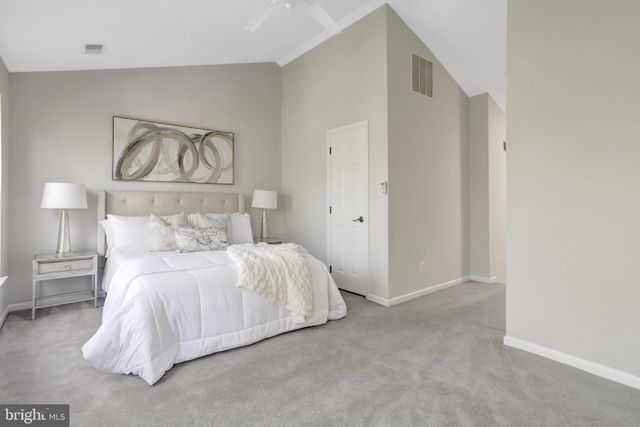 a bedroom with a bed and painting on the wall