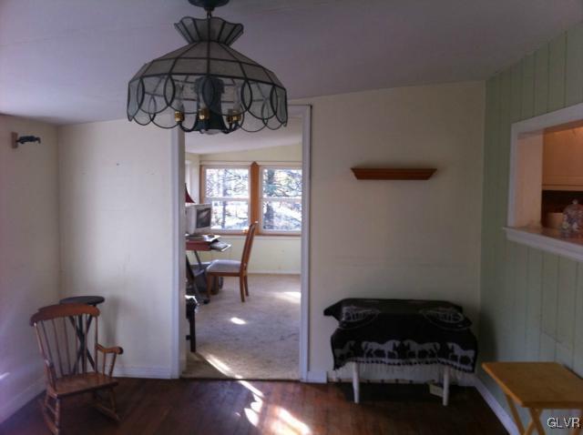 508 Westbrook Road Effort, PA 18330 - Photo 25 of 49 a bedroom with a bed and chandelier
