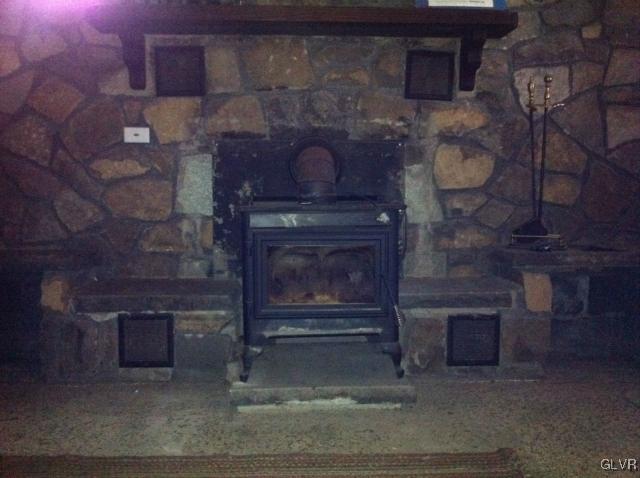 508 Westbrook Road Effort, PA 18330 - Photo 4 of 49 a fireplace with a clock on top of it