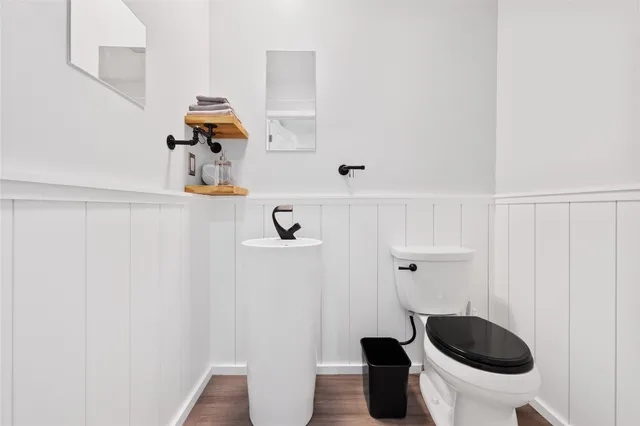 a bathroom with a toilet and a sink