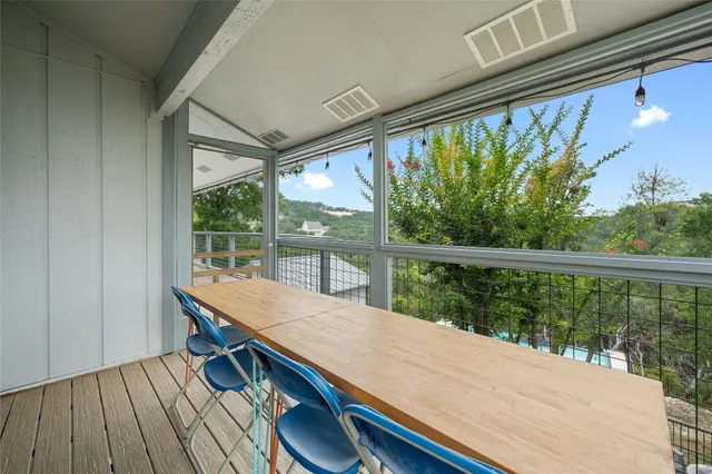 a view of a balcony with wooden floor