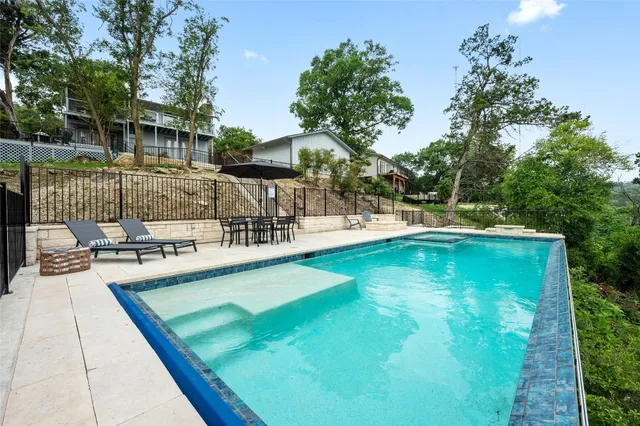 a view of a swimming pool with a patio