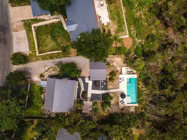 an aerial view of residential houses with outdoor space