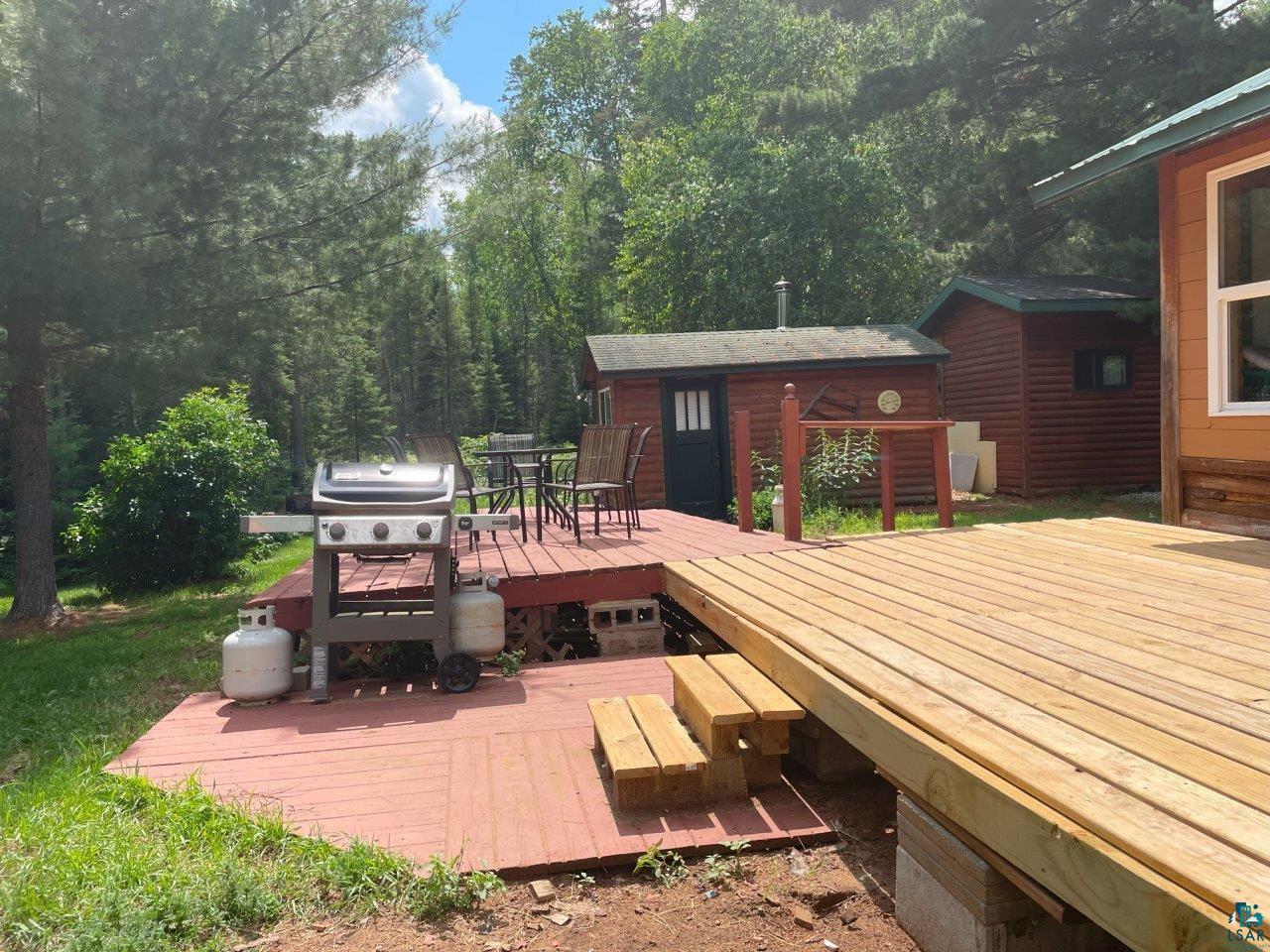 3420 Dewees Road Babbitt, MN 55706 - Photo 12 of 58 Wooden deck offers more outdoor seating.