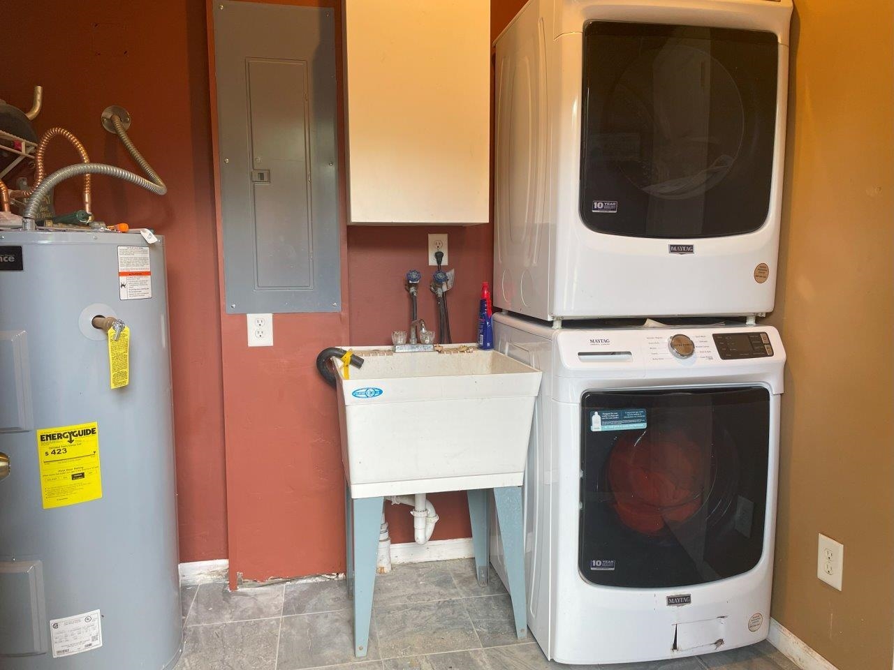 3420 Dewees Road Babbitt, MN 55706 - Photo 29 of 58 Laundry room with electric water heater, electric panel, and stacked washer / dryer