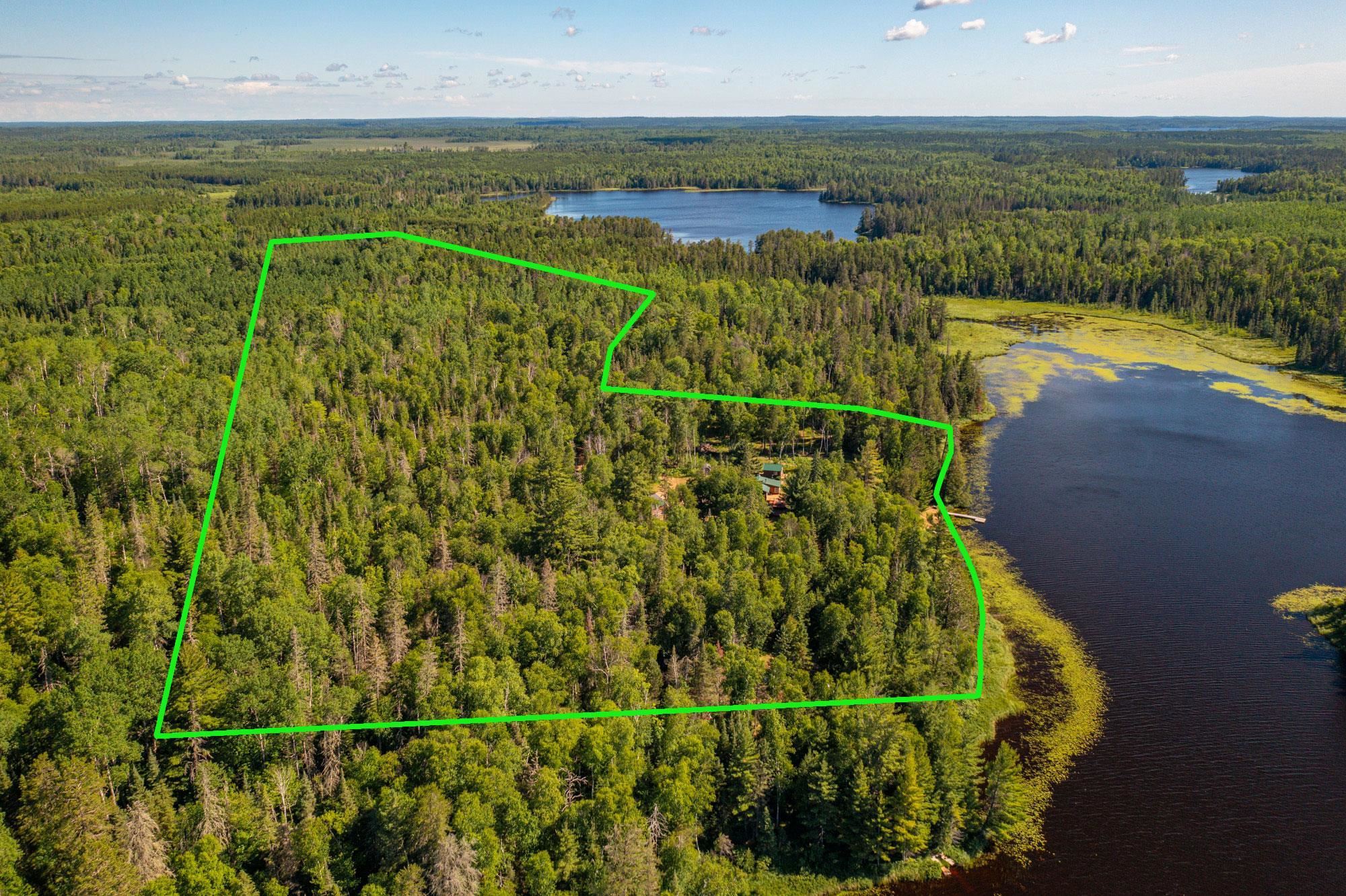 3420 Dewees Road Babbitt, MN 55706 - Photo 58 of 58 Aerial view of property and surrounding area with property boundaries highlighted. Arthur Lake in the distance.