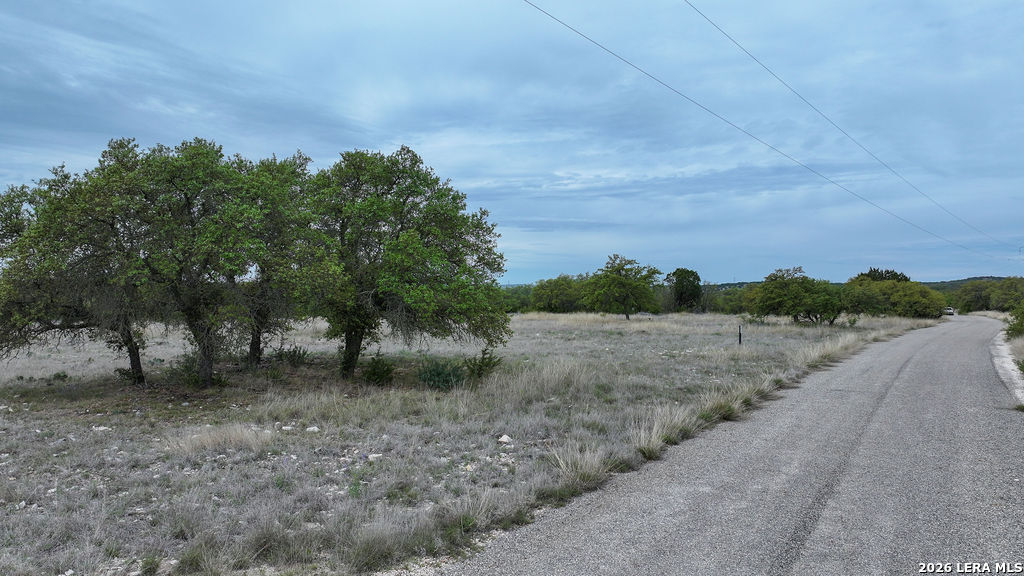 684 Lester Ln Junction Junction, TX 76849 - Photo 13 of 15 a view of a dry yard with wooden fence