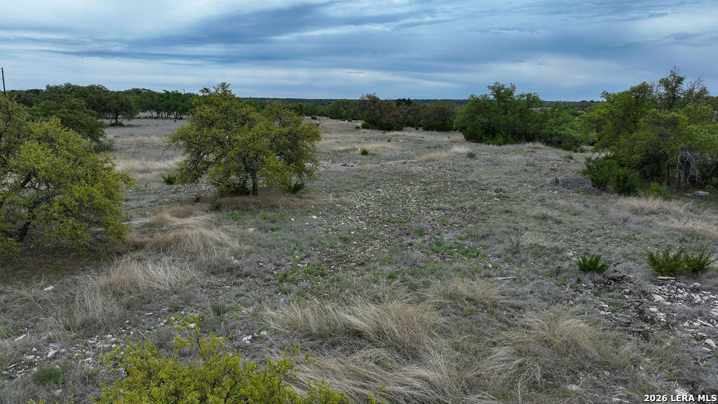 684 Lester Ln Junction Junction, TX 76849 - Photo 10 of 15 a view of a dirt field with lots of green space