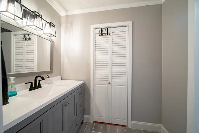 a bathroom with a sink and a mirror