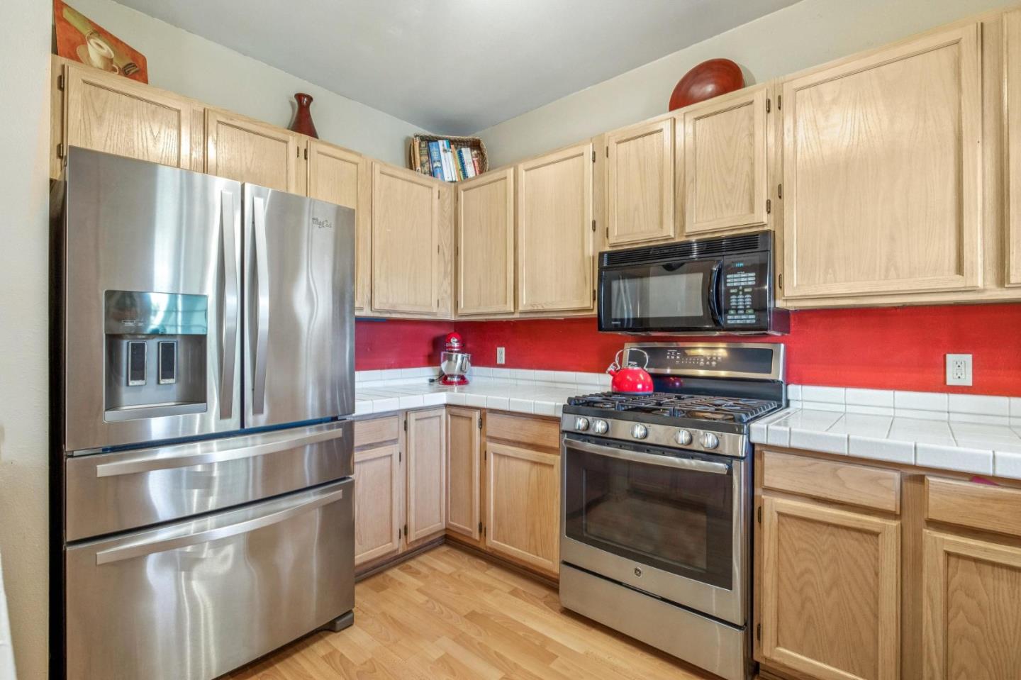 175 Troon Way Half Moon Bay, CA 94019 - Photo 20 of 49 a kitchen with stainless steel appliances kitchen island granite countertop a refrigerator stove and sink