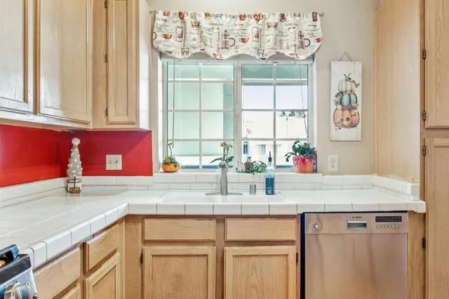a kitchen with a sink and a window