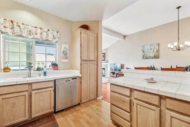 a spacious bathroom with a sink and a mirror