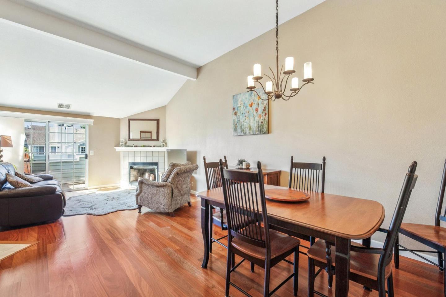 175 Troon Way Half Moon Bay, CA 94019 - Photo 25 of 49 a dining room with furniture a chandelier and wooden floor