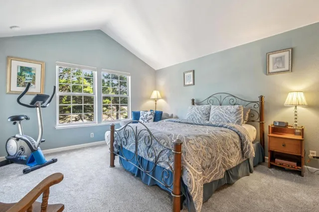 a bedroom with bed and a window