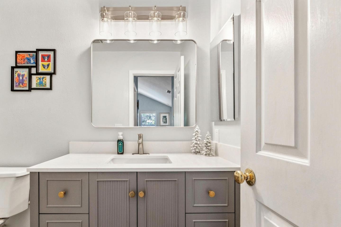 175 Troon Way Half Moon Bay, CA 94019 - Photo 32 of 49 a bathroom with a sink and a mirror