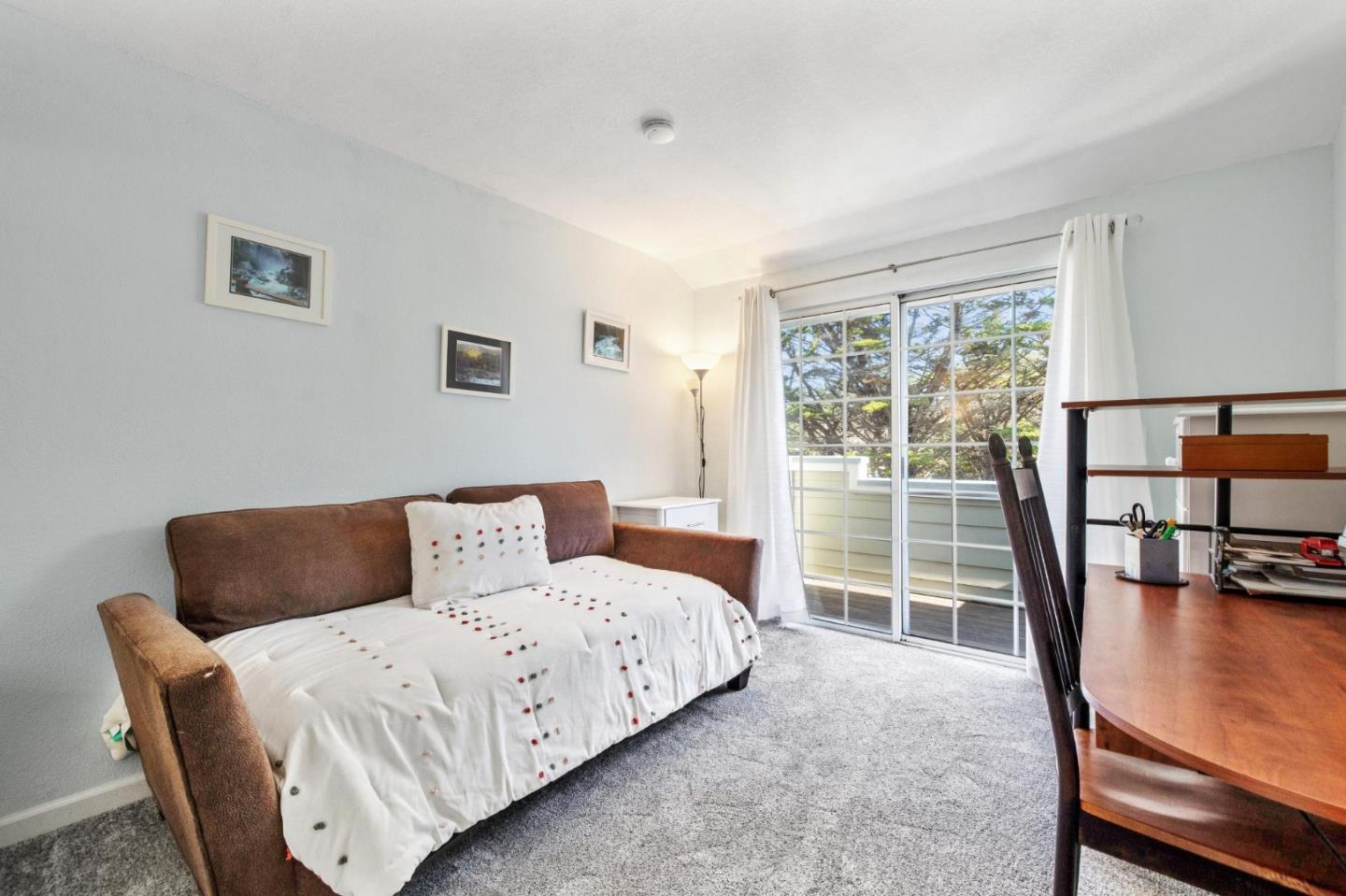 175 Troon Way Half Moon Bay, CA 94019 - Photo 35 of 49 a bedroom with a bed and wooden floor