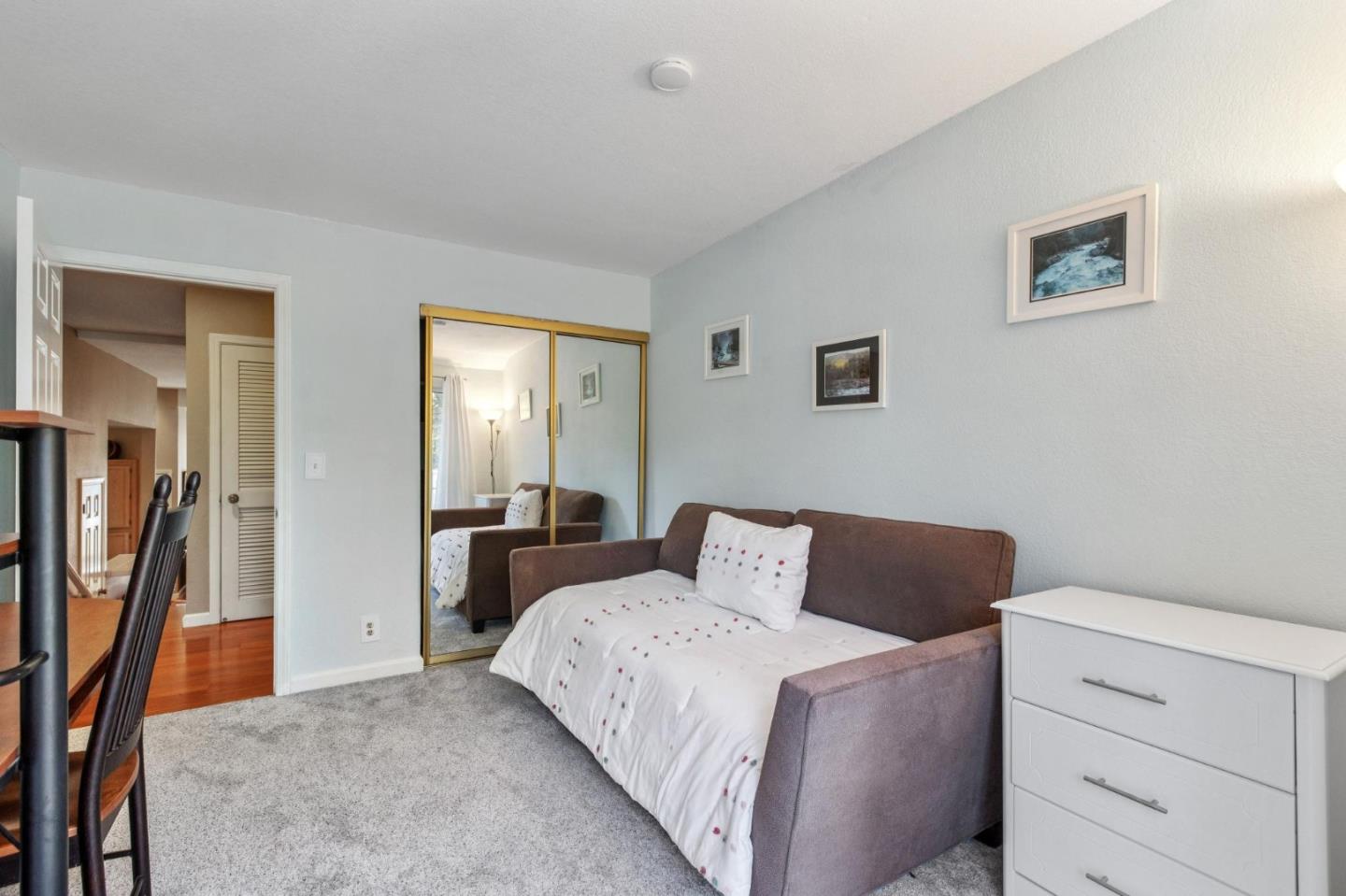 175 Troon Way Half Moon Bay, CA 94019 - Photo 41 of 49 a bedroom with a bed and a lamp