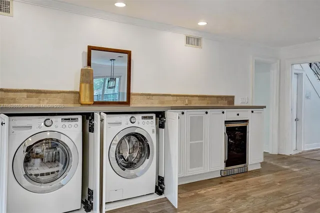 a bathroom with a granite countertop sink and a toilet