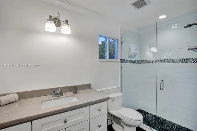 a bedroom with a bed and a fireplace