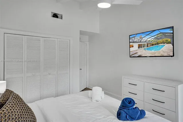 a bedroom with a bed and a fireplace