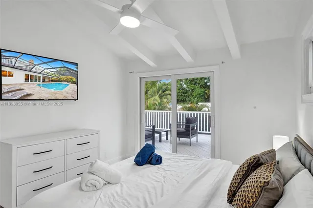 an aerial view of a house with a yard and garden