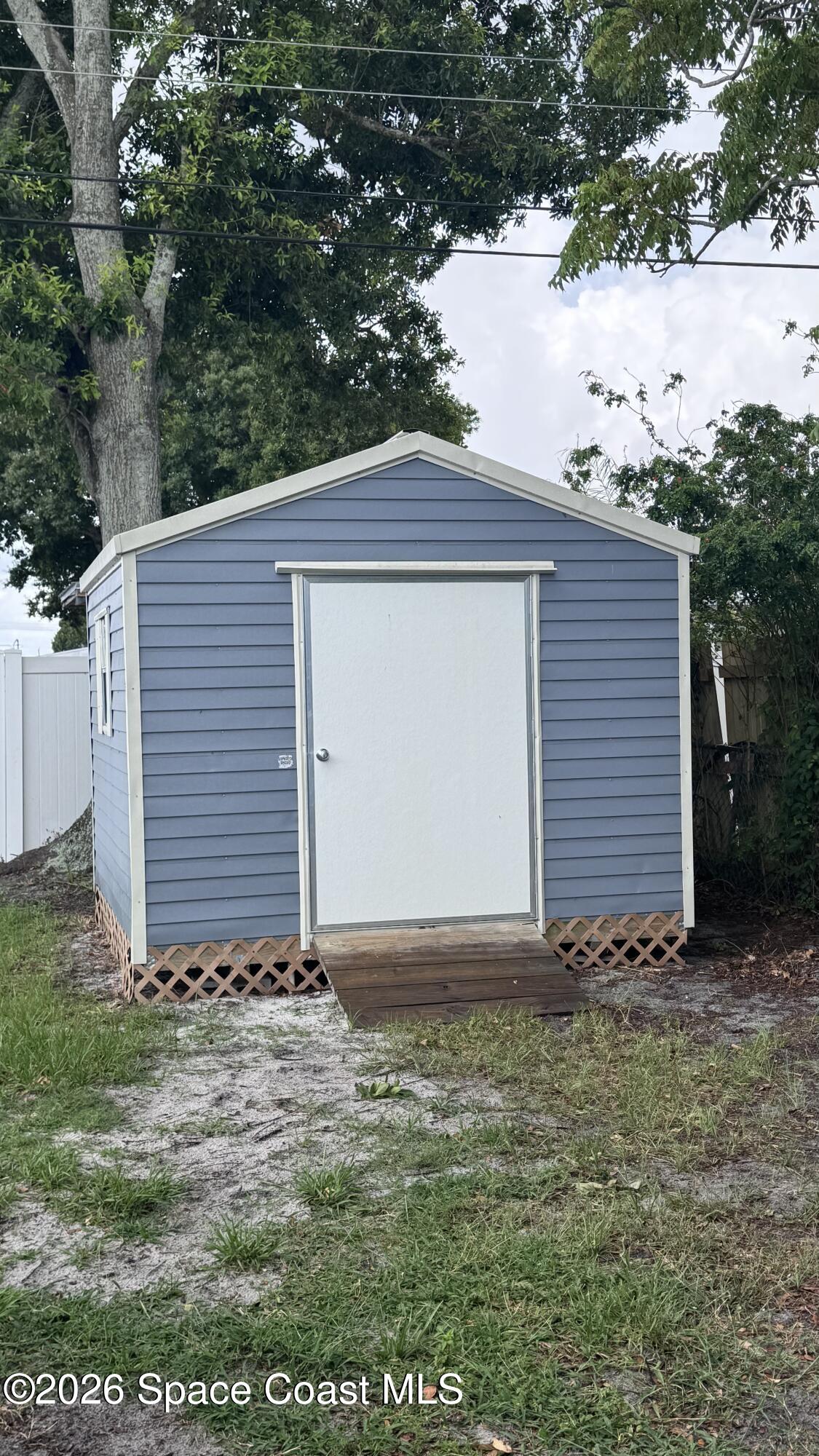2137 Laden Road Melbourne, FL 32935 - Photo 22 of 23 a view of a house with backyard and garden