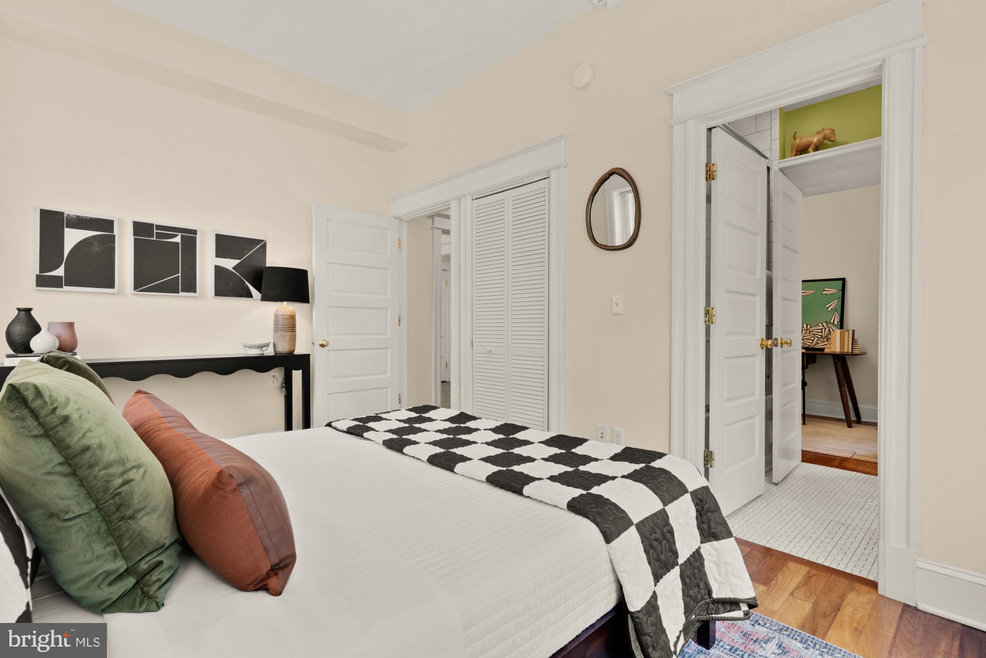 1833 S Street Northwest, Unit 2 Washington, DC 20009 - Photo 15 of 29 a bedroom with a bed and wooden floor