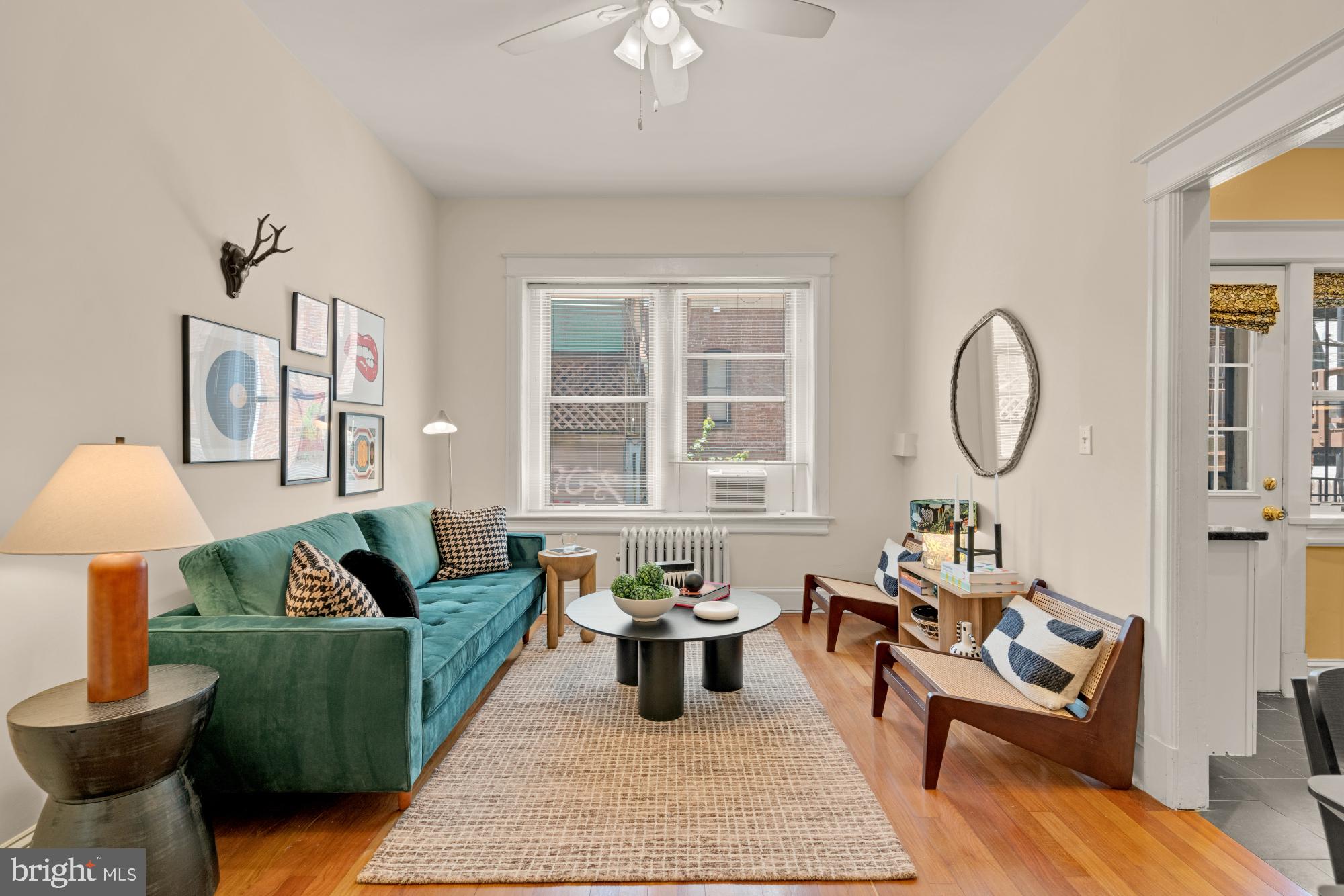 1833 S Street Northwest, Unit 2 Washington, DC 20009 - Photo 4 of 29 a living room with furniture a rug and a window