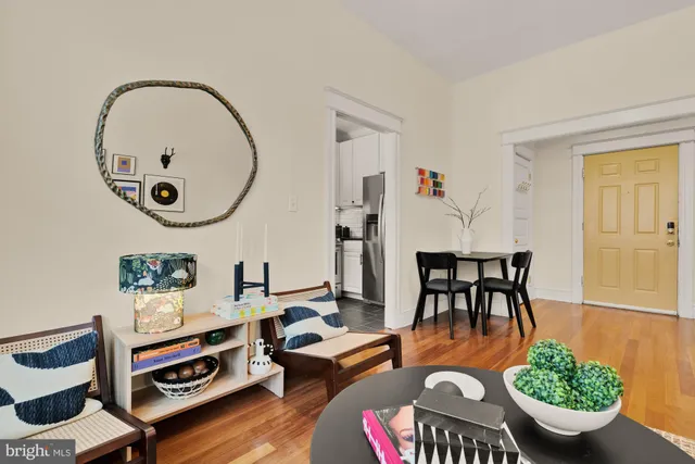 a kitchen with stainless steel appliances white cabinets and a stove